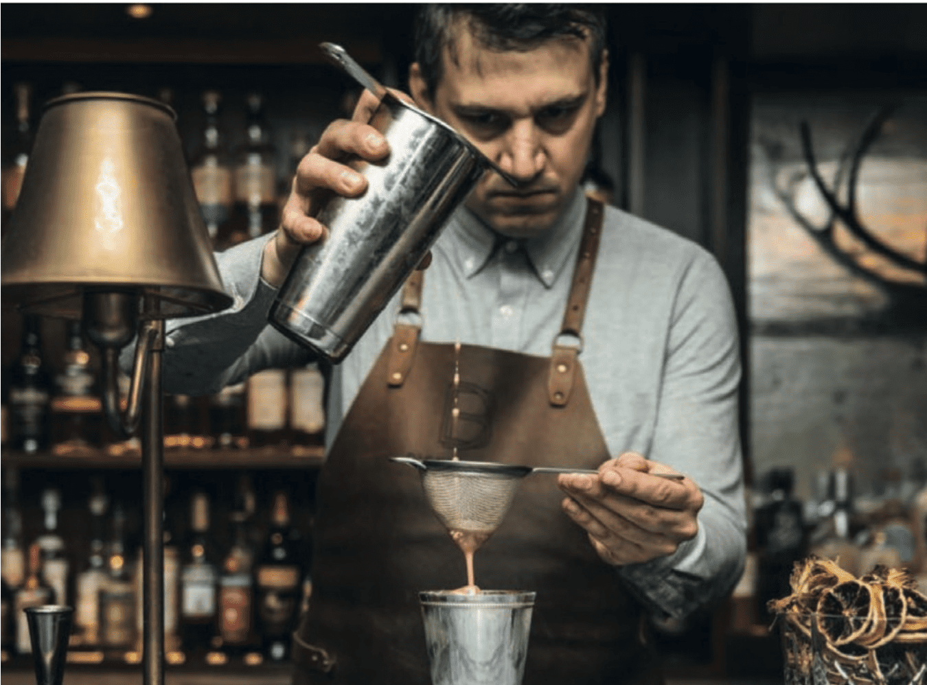 Mixologist Pouring Drink